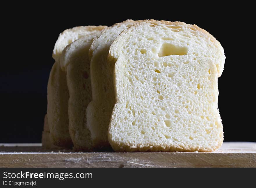 Close up of bread slices on a black background