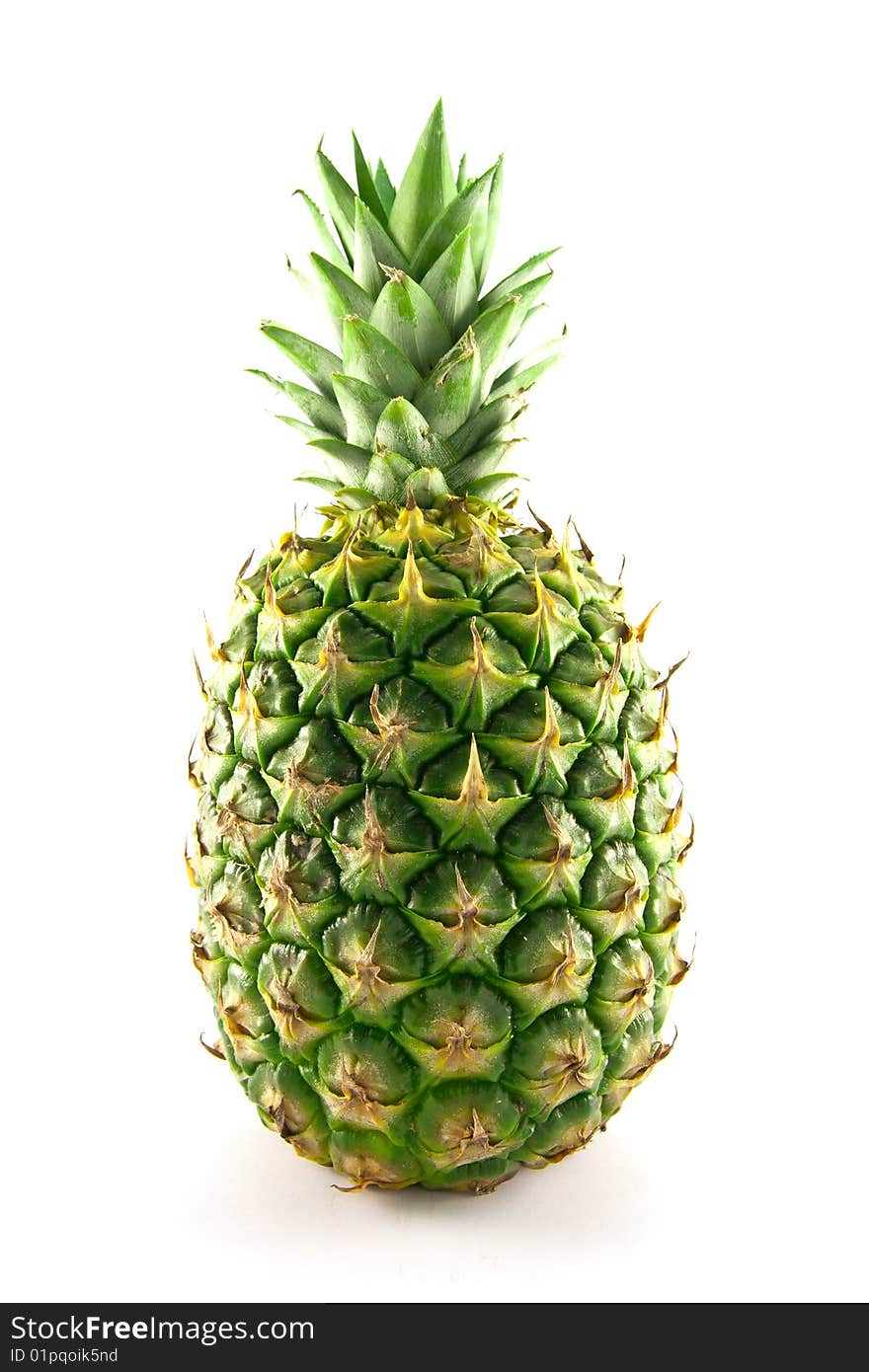 Fresh delicious looking green pineapple fruit on a white background with a clipping path. Fresh delicious looking green pineapple fruit on a white background with a clipping path