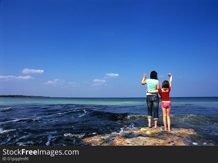 Woman And Girl Admiring Sea