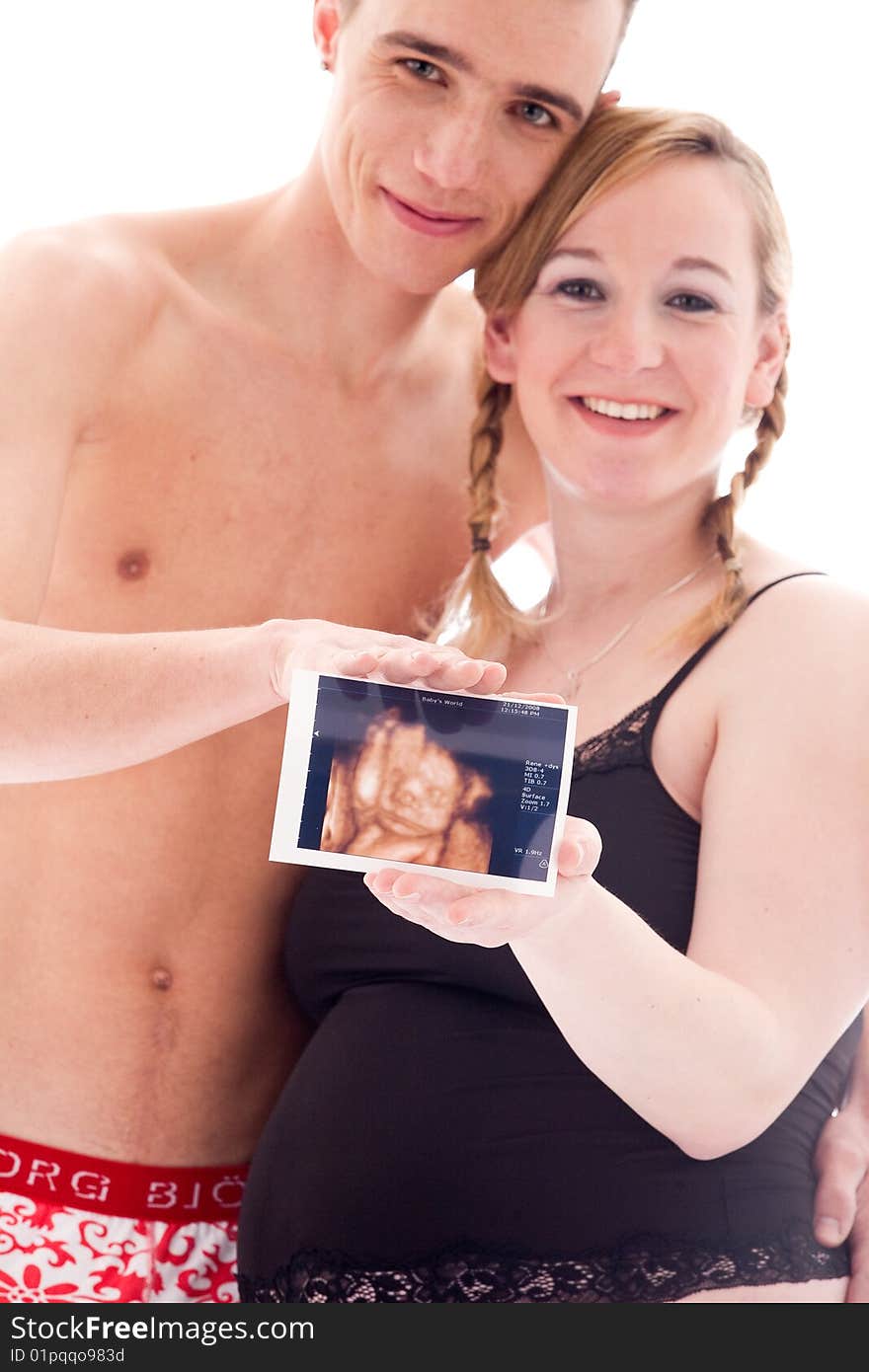 Young lovely caucasian couple expecting their baby. Young lovely caucasian couple expecting their baby