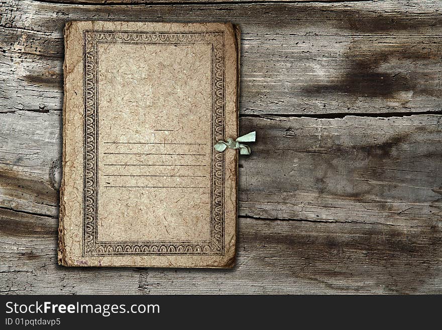 Old folder isolated on old wooden background