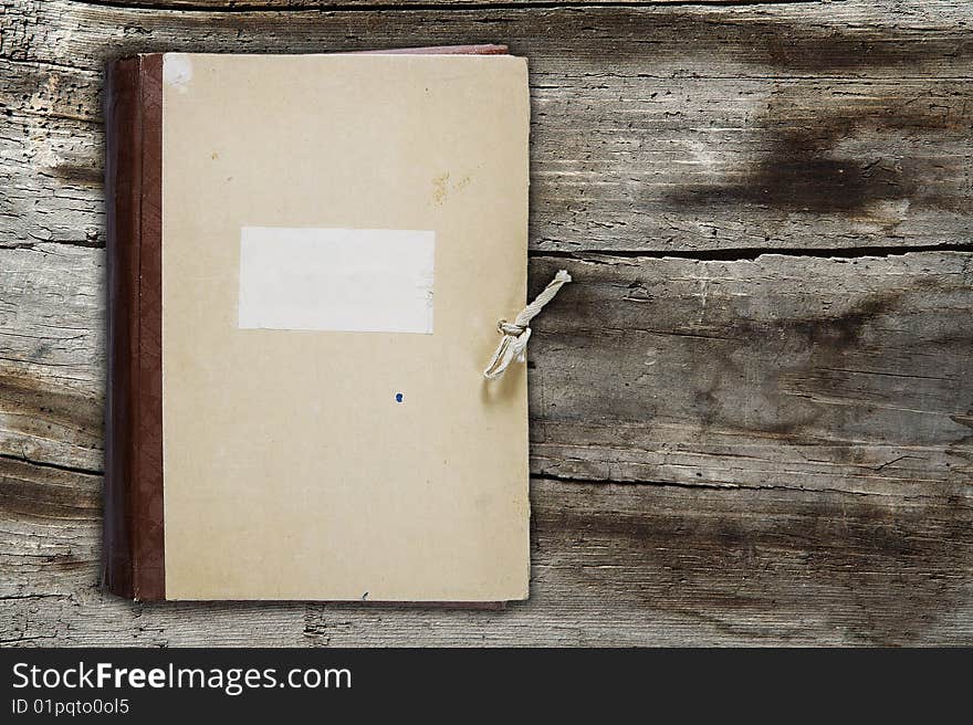 Old folder on old wooden background