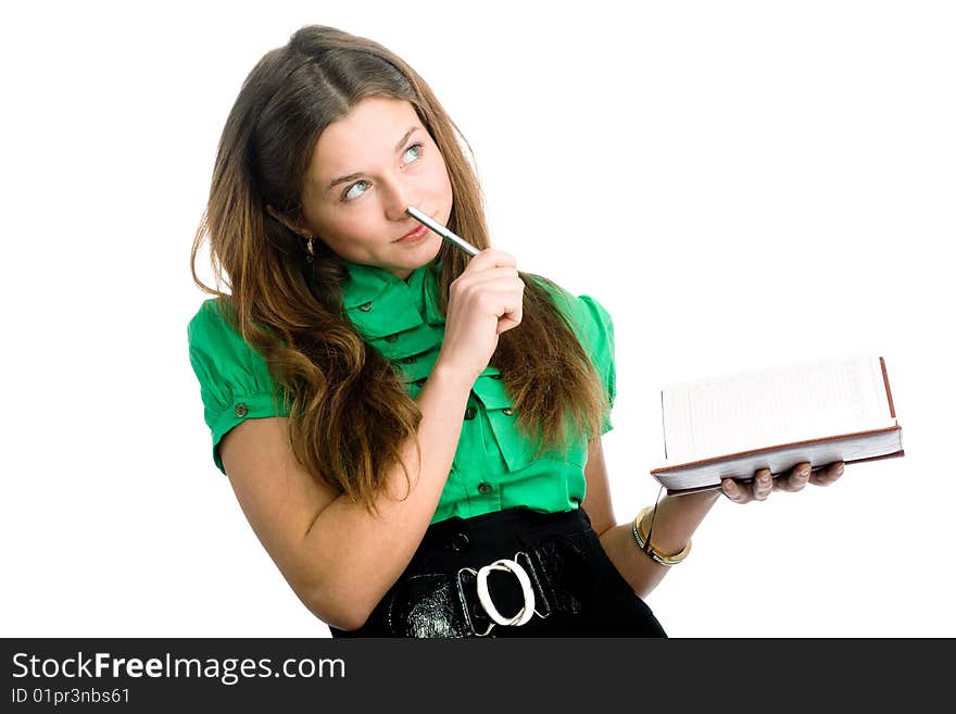 A graceful female student with a pen and a copybook in her hands