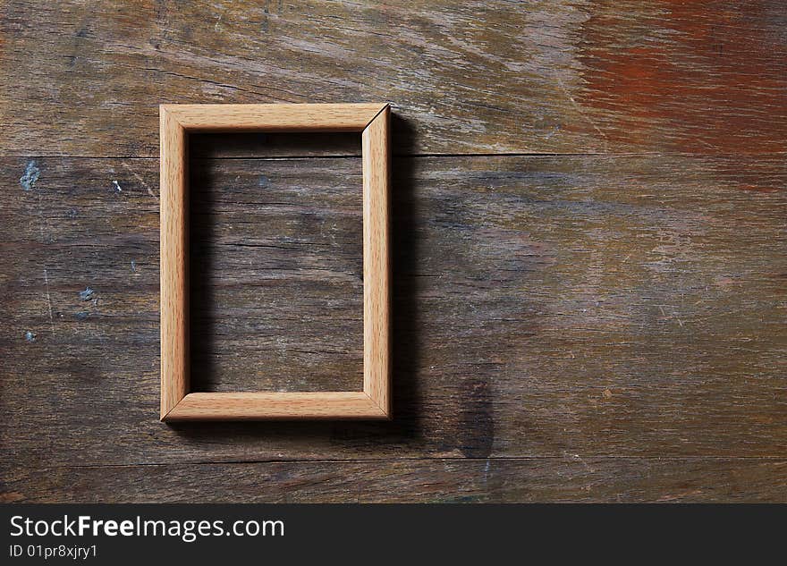 Empty photo-frame on wooden background. Empty photo-frame on wooden background