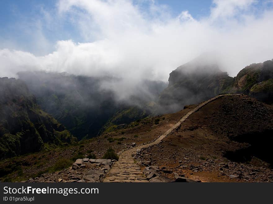 A path that leads to the mountains. This picture is taken in Madeira Portugal. A path that leads to the mountains. This picture is taken in Madeira Portugal