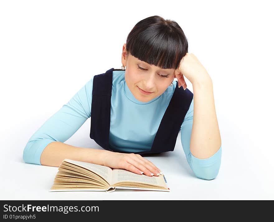 Girl laying on the floor and reading book