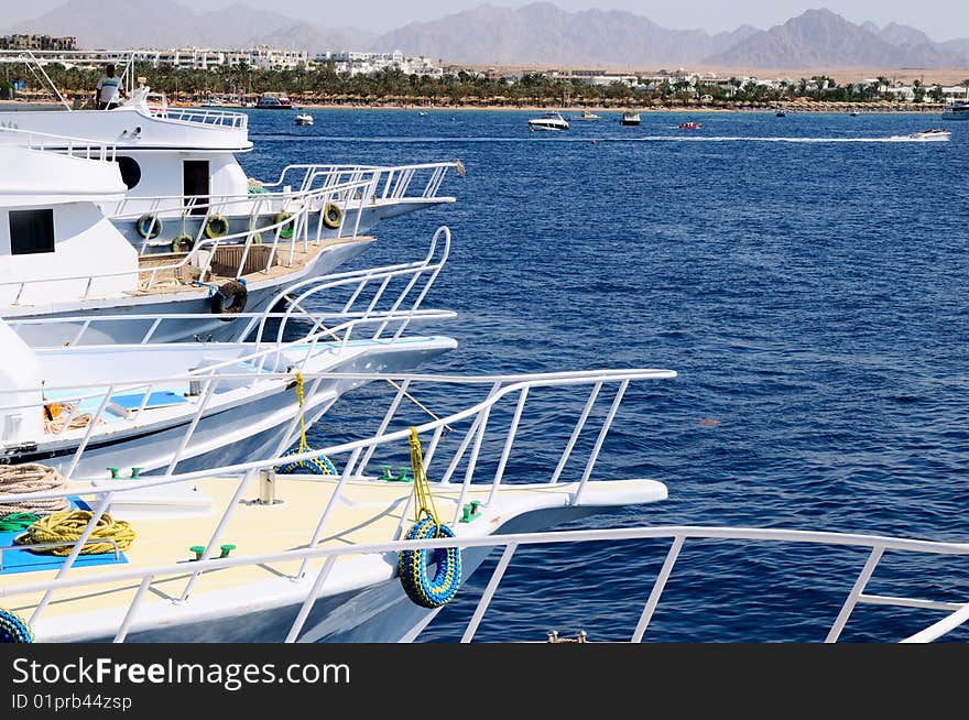 Beautiful boats on a mooring at coast of Red sea in Egypt. Beautiful boats on a mooring at coast of Red sea in Egypt