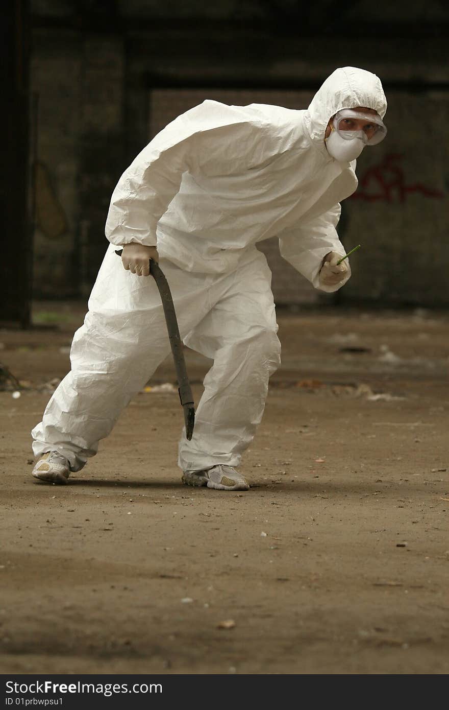 Worker with metal rod looked at something. Worker with metal rod looked at something