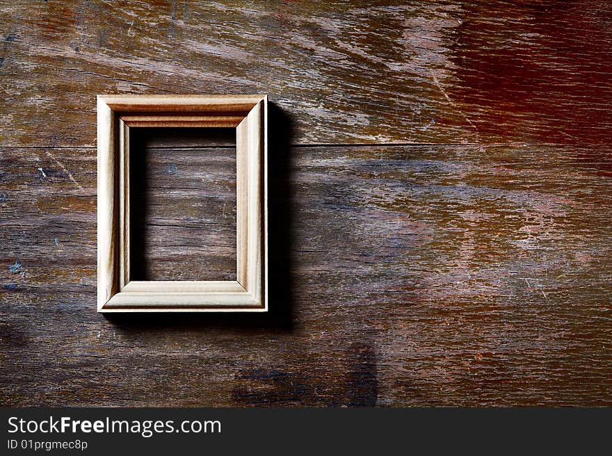 Empty photo-frame on wooden background. Empty photo-frame on wooden background