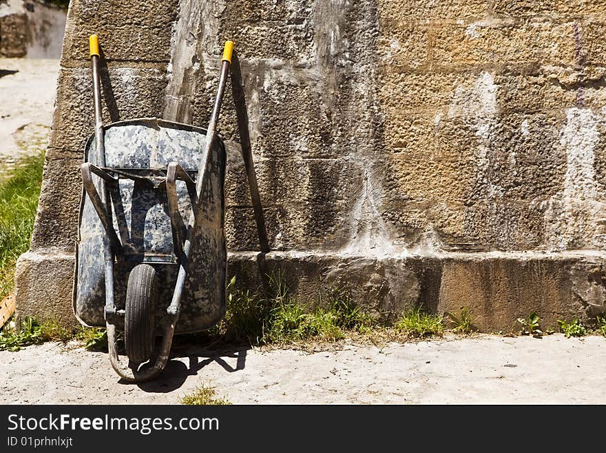 Wheelbarrow on wall