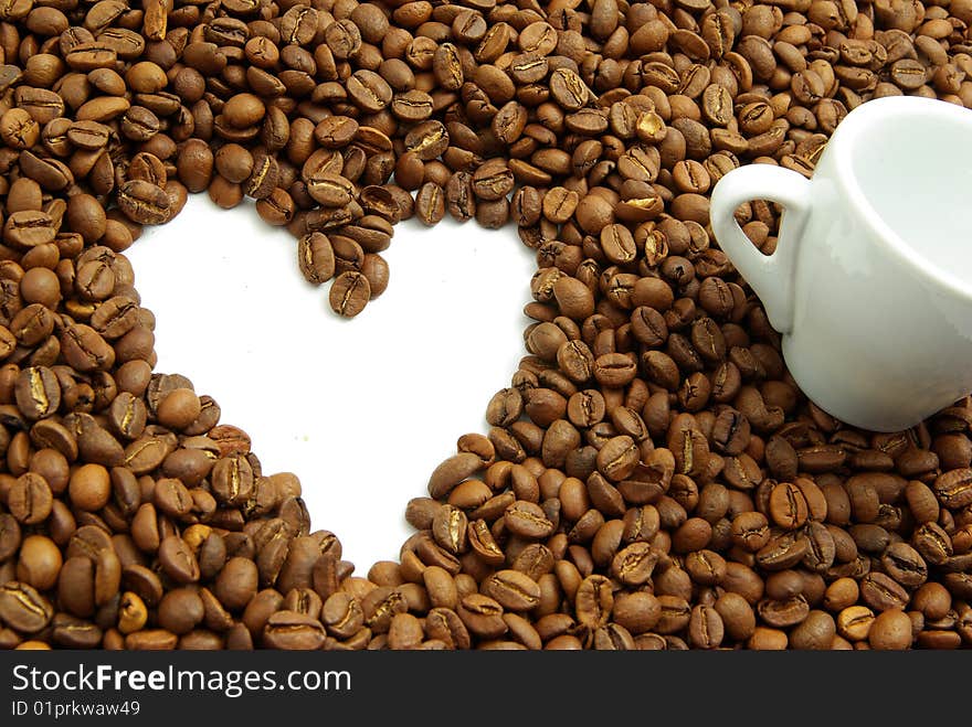 Coffee beans in a white cup