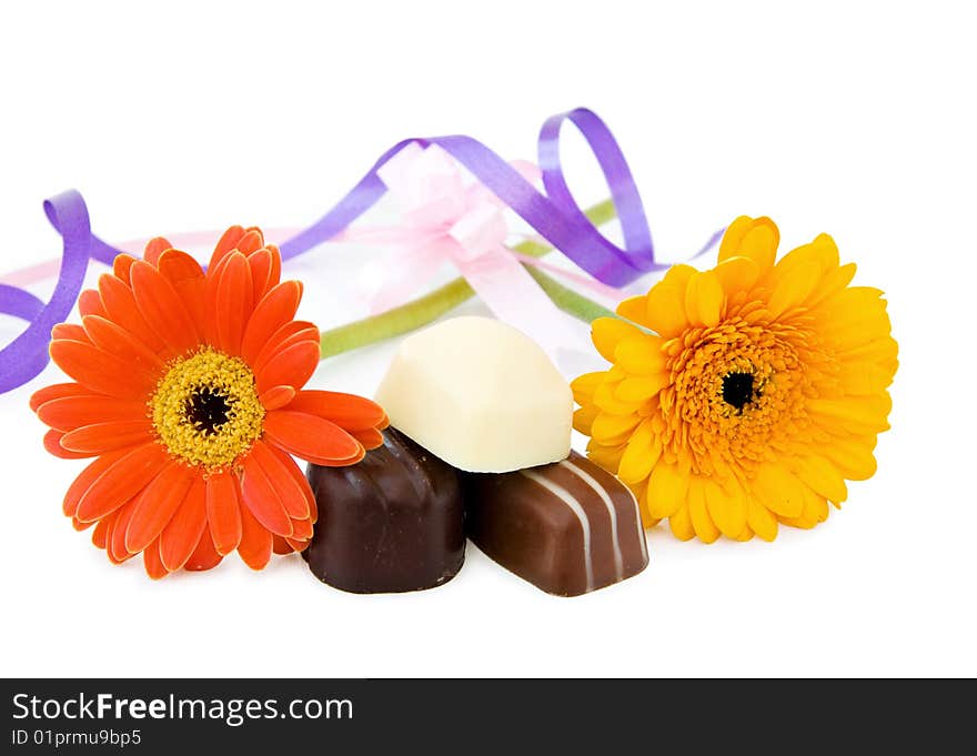 Luxury chocolates with flowers and ribbons