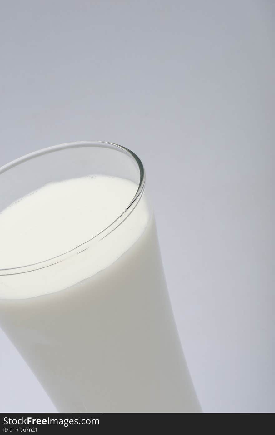 A glass of milk on gray  background