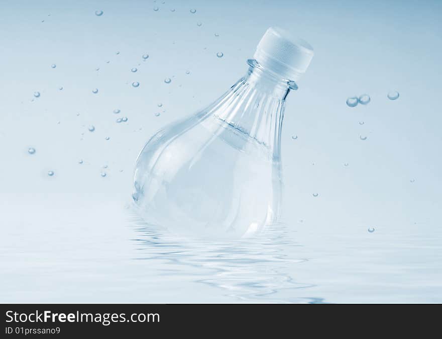 Bottled water over a white-blue background. Bottled water over a white-blue background