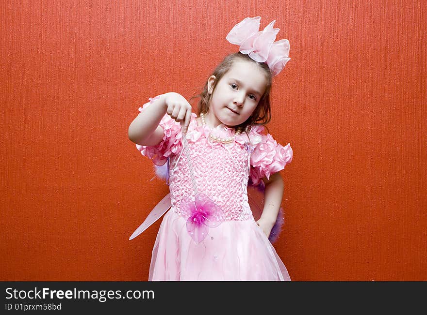 Little Girl Dressed In Pink With Wings