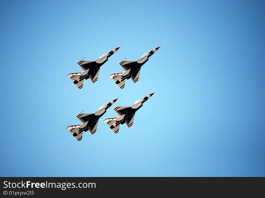 USAF Thunderbirds in formation on a steep vertical ascent. USAF Thunderbirds in formation on a steep vertical ascent