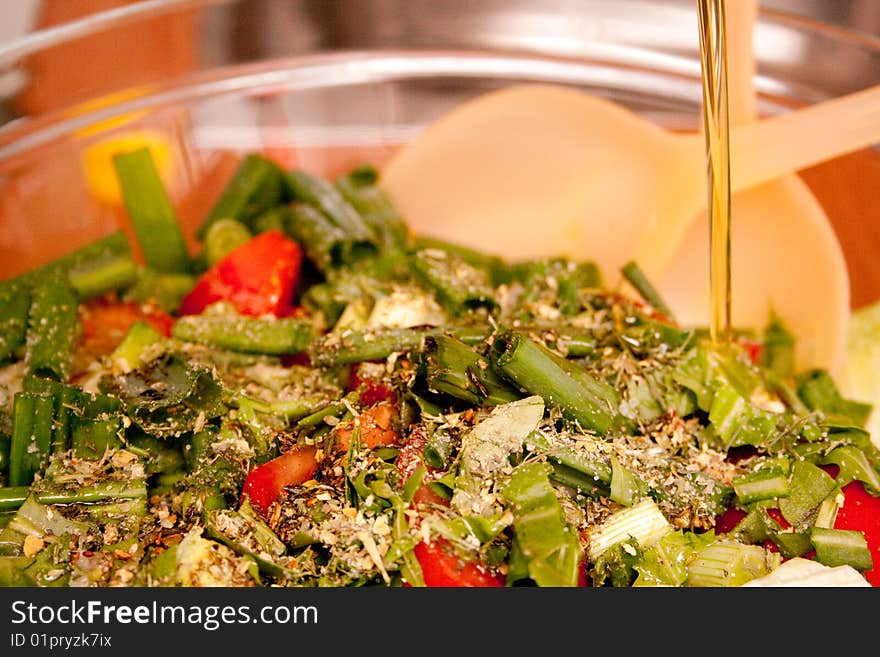 Salad With Herbs Adding Oil