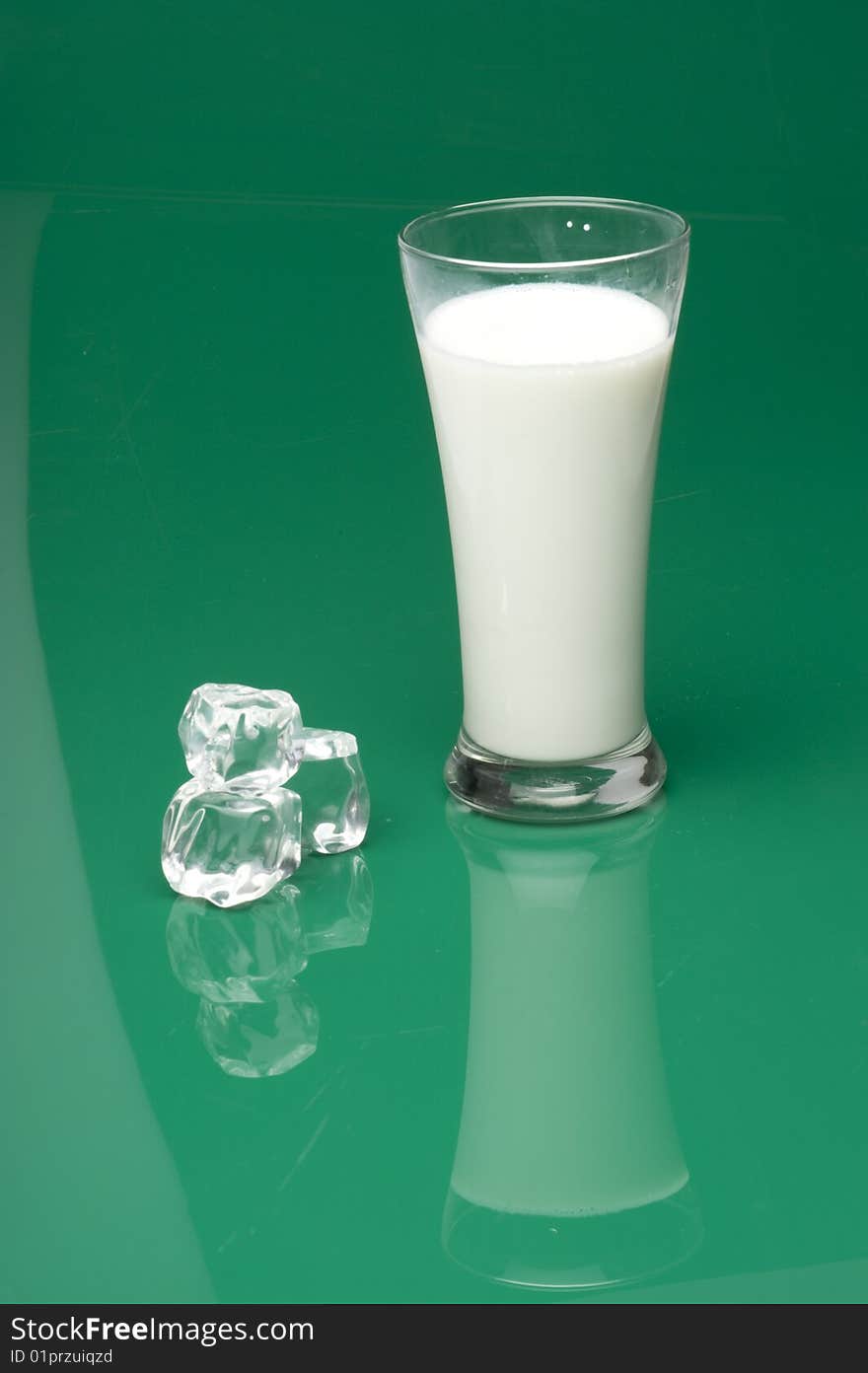 Glass of milk with ice cube