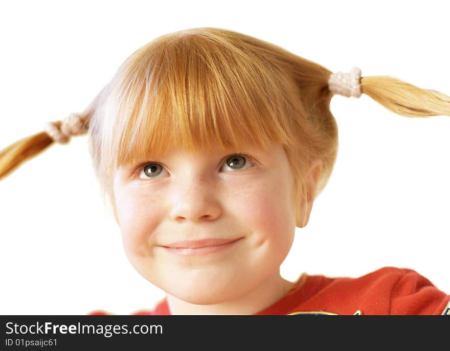 Cheerful 4 years old girl with funny tails looking up