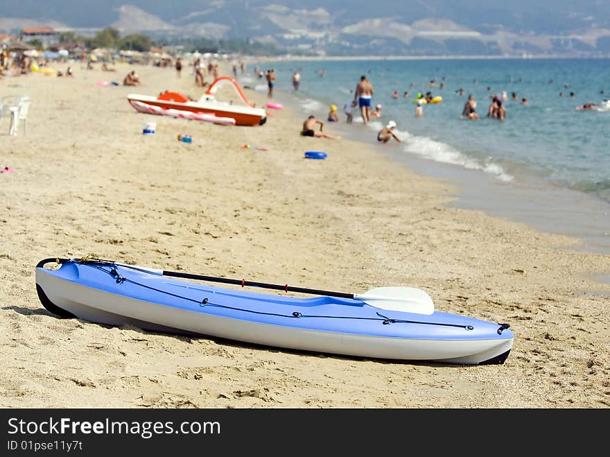 Blue canoe on a sandy beautiful beach. Blue canoe on a sandy beautiful beach