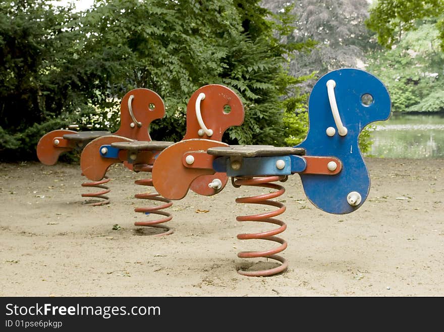 Spring Swings on children's playground in the park. Spring Swings on children's playground in the park