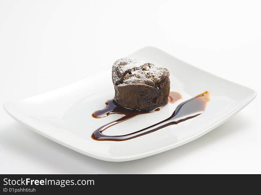 Delicious chocolate cake and caramel isolated over white