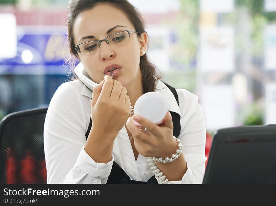 Portrait of young pretty woman in business environment. Portrait of young pretty woman in business environment