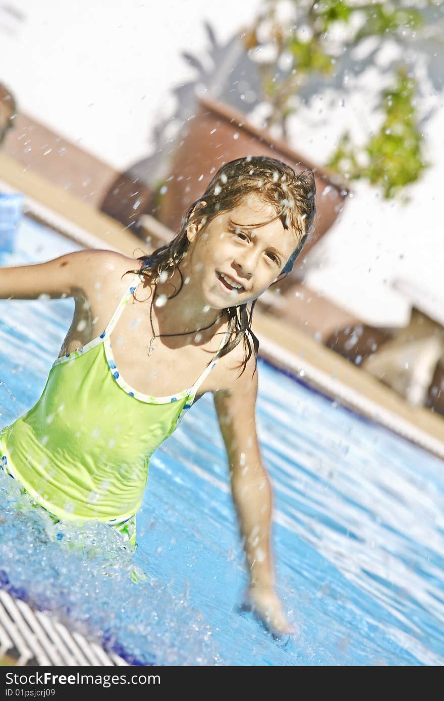 Portrait of little white girl having fun  in swimming pool. Portrait of little white girl having fun  in swimming pool