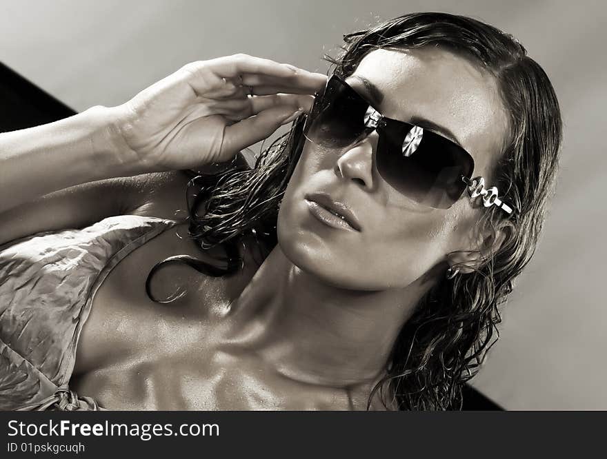 Stylish  high-contrast portrait of nice woman  in sunglasses. Stylish  high-contrast portrait of nice woman  in sunglasses