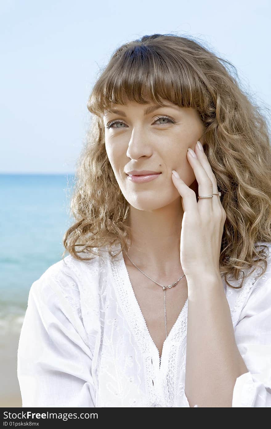 Portrait of nice young woman having good time on the beach. Portrait of nice young woman having good time on the beach