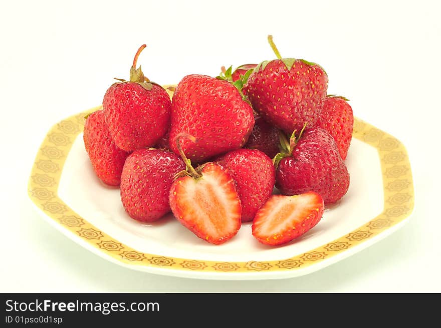 Strawberry in a plate on a white background