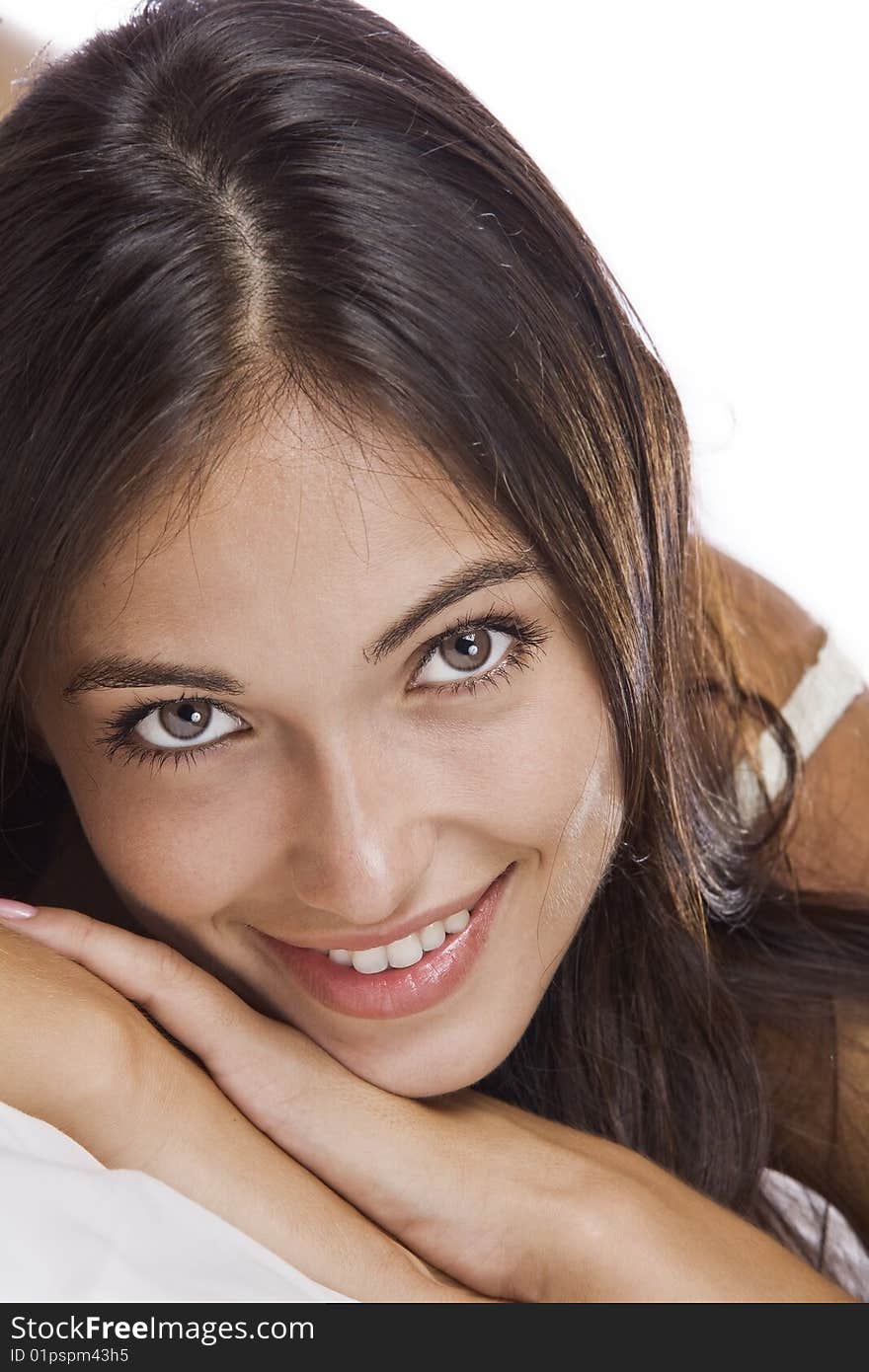 Portrait of young beautiful woman on white sheet. Portrait of young beautiful woman on white sheet