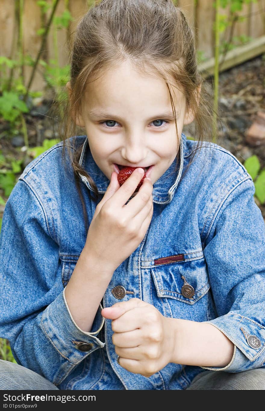 Girl Eating A Strawberry