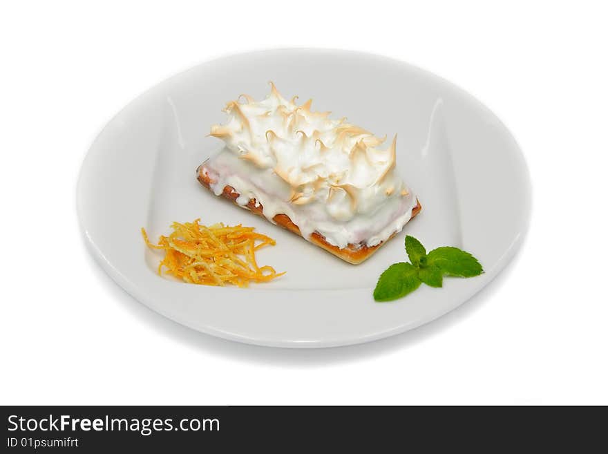 Sweet Baked Meringue Ice Cream Cake on the White Plate