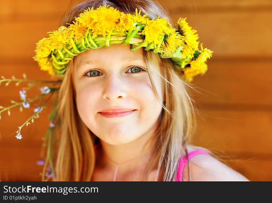 Portrait of the beautiful  girl in a wreath. Portrait of the beautiful  girl in a wreath