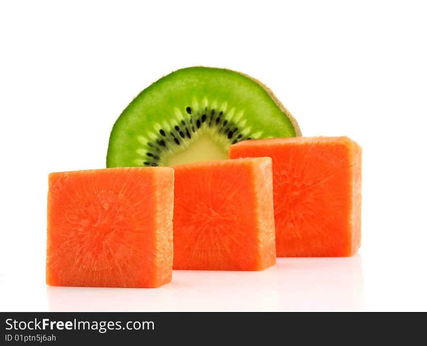 Carrot bricks and kiwi lobule isolated on a white background