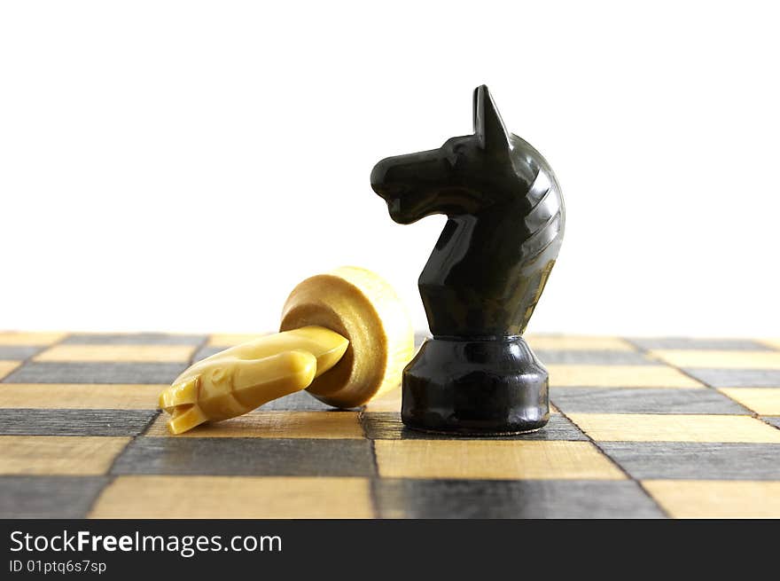 Chess battle on white background