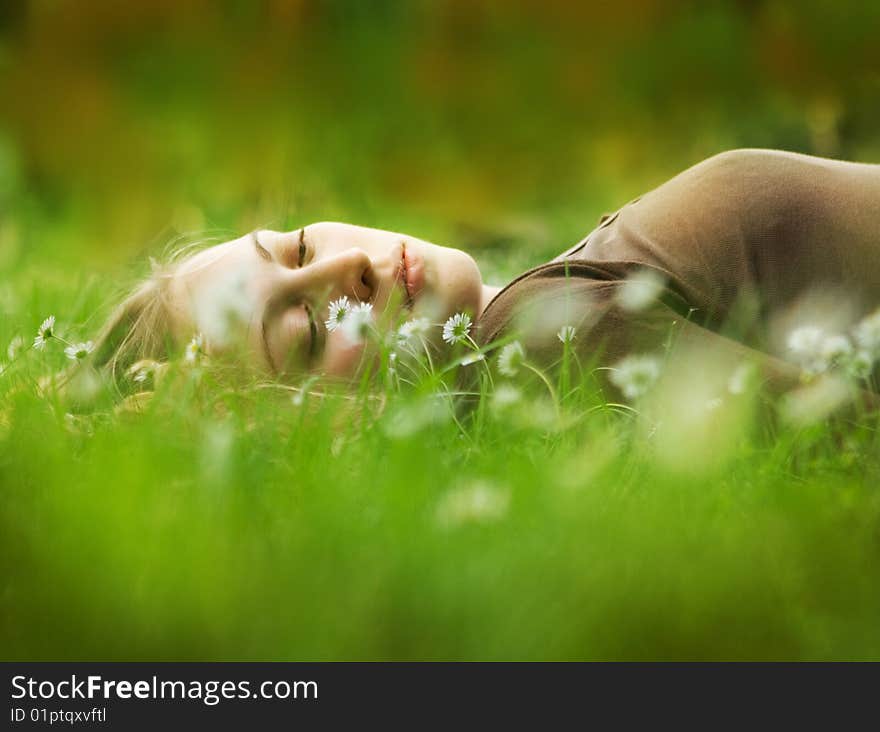 Girl lying in grass