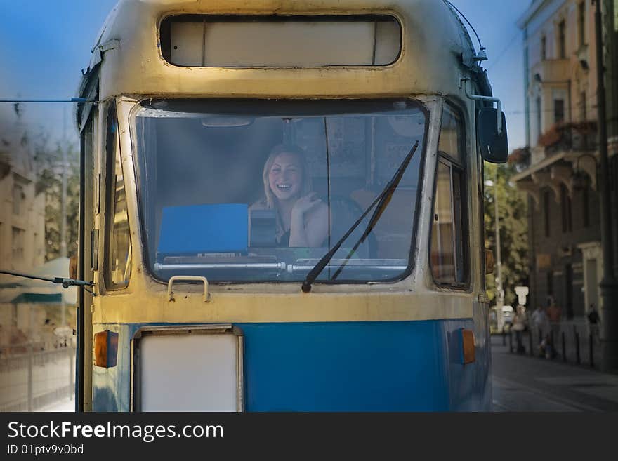 Woman in an old historical tram - city scene. Woman in an old historical tram - city scene