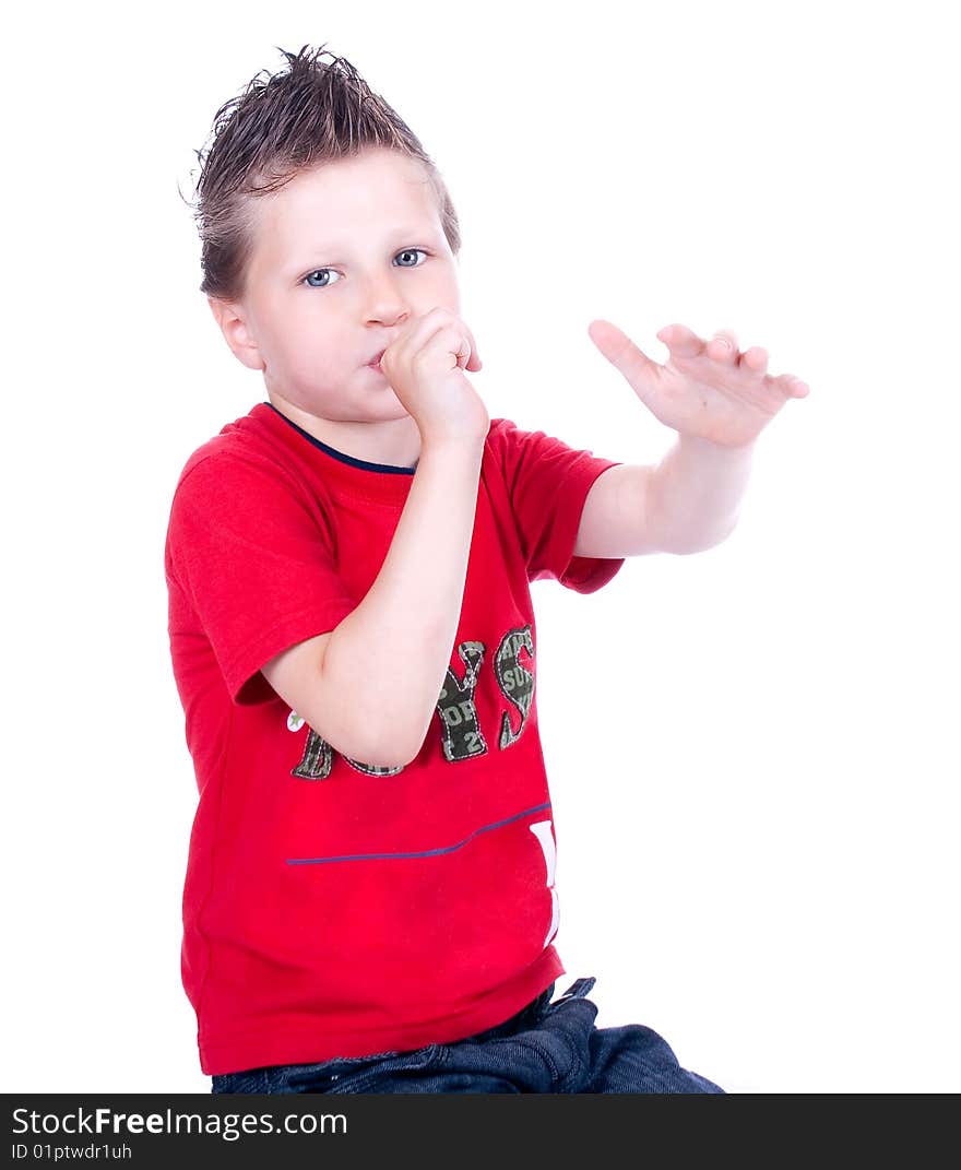 Cute blue-eyed boy posing in studio