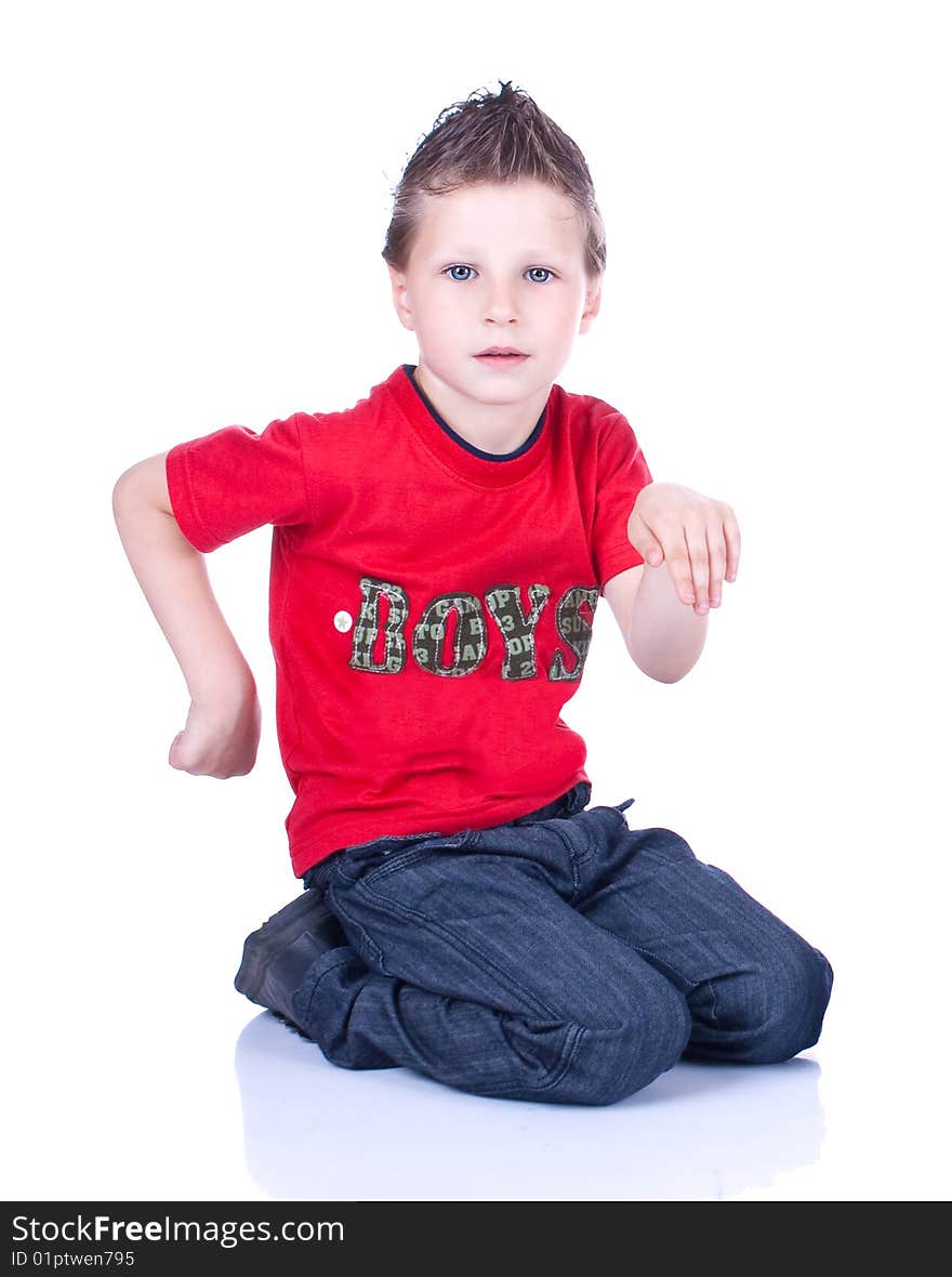 Cute blue-eyed boy posing in studio