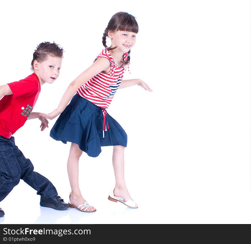 Cute blue-eyed children posing in studio