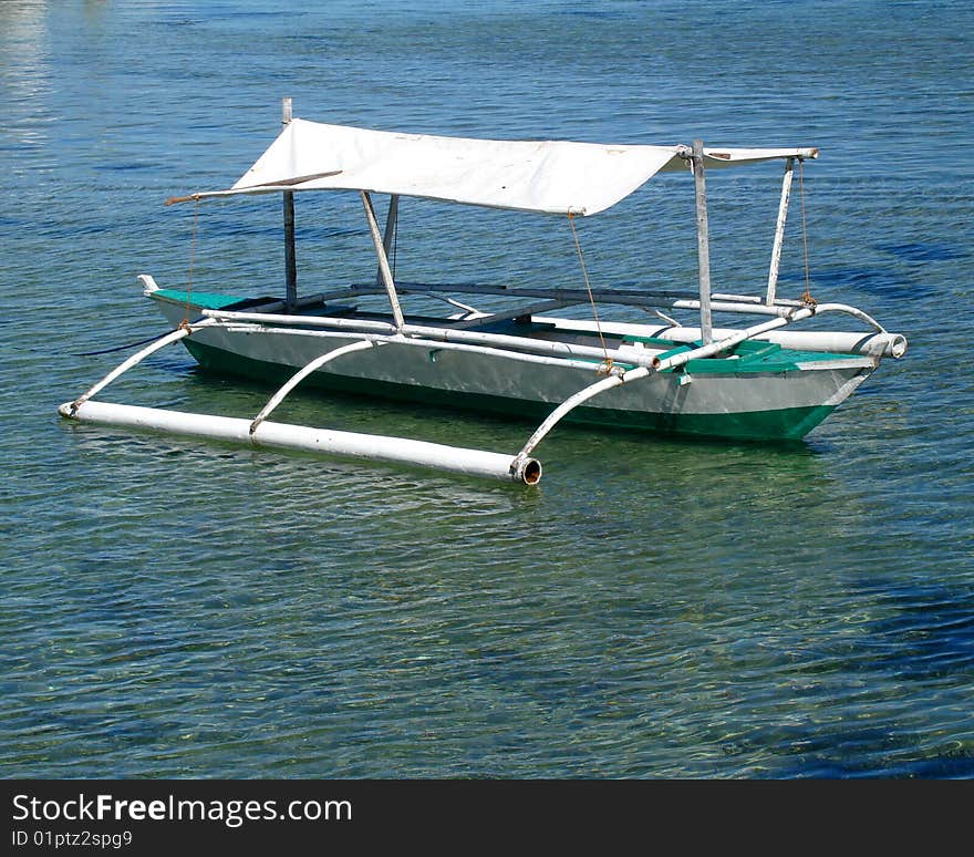 A small fishing bunker against a blue green sea