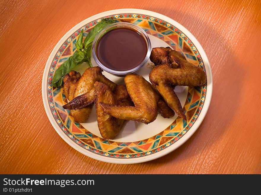 Roasted chicken wings, closeup studio shot