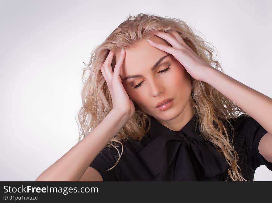 A shot of a businesswoman having a headache, studio shot. A shot of a businesswoman having a headache, studio shot