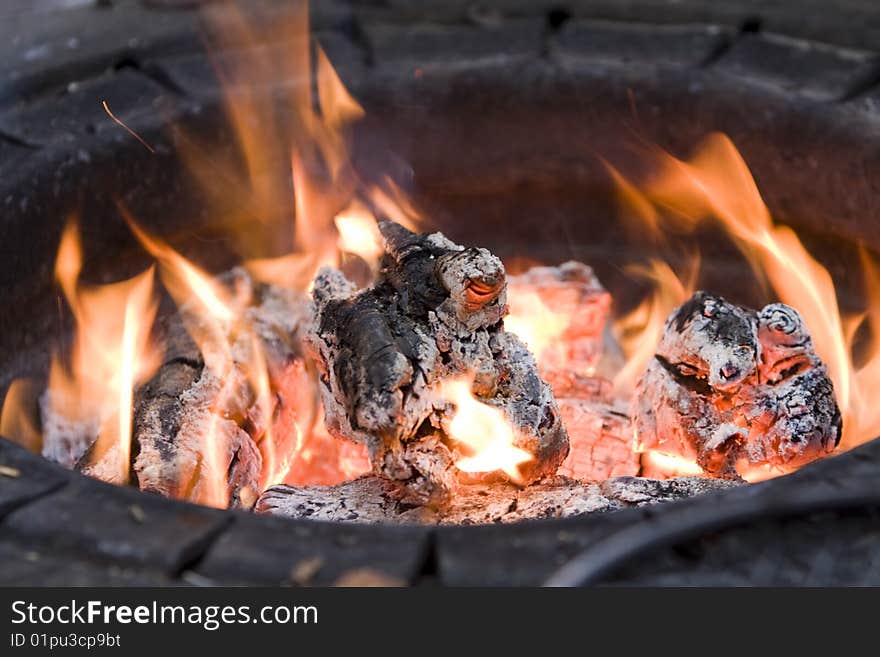 Glowing coals in the hearth equipped in the woods. Glowing coals in the hearth equipped in the woods