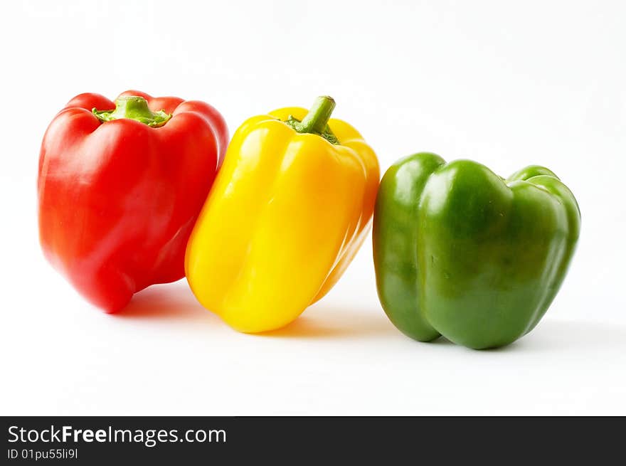 Tree bell peppers on a white background