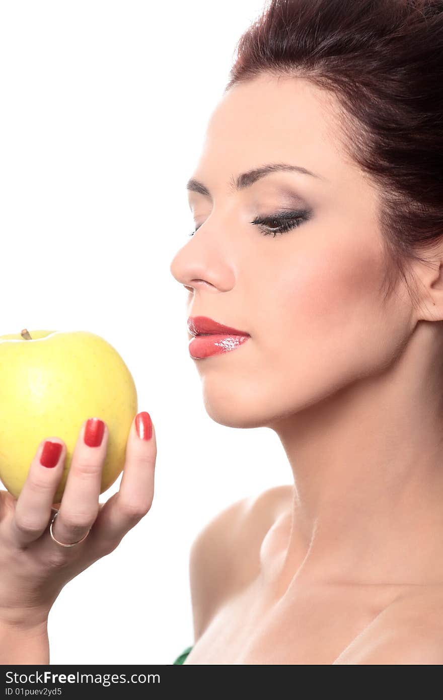 Close-up portrait of young beautiful healthy woman with yellow apple isolated on white. Close-up portrait of young beautiful healthy woman with yellow apple isolated on white