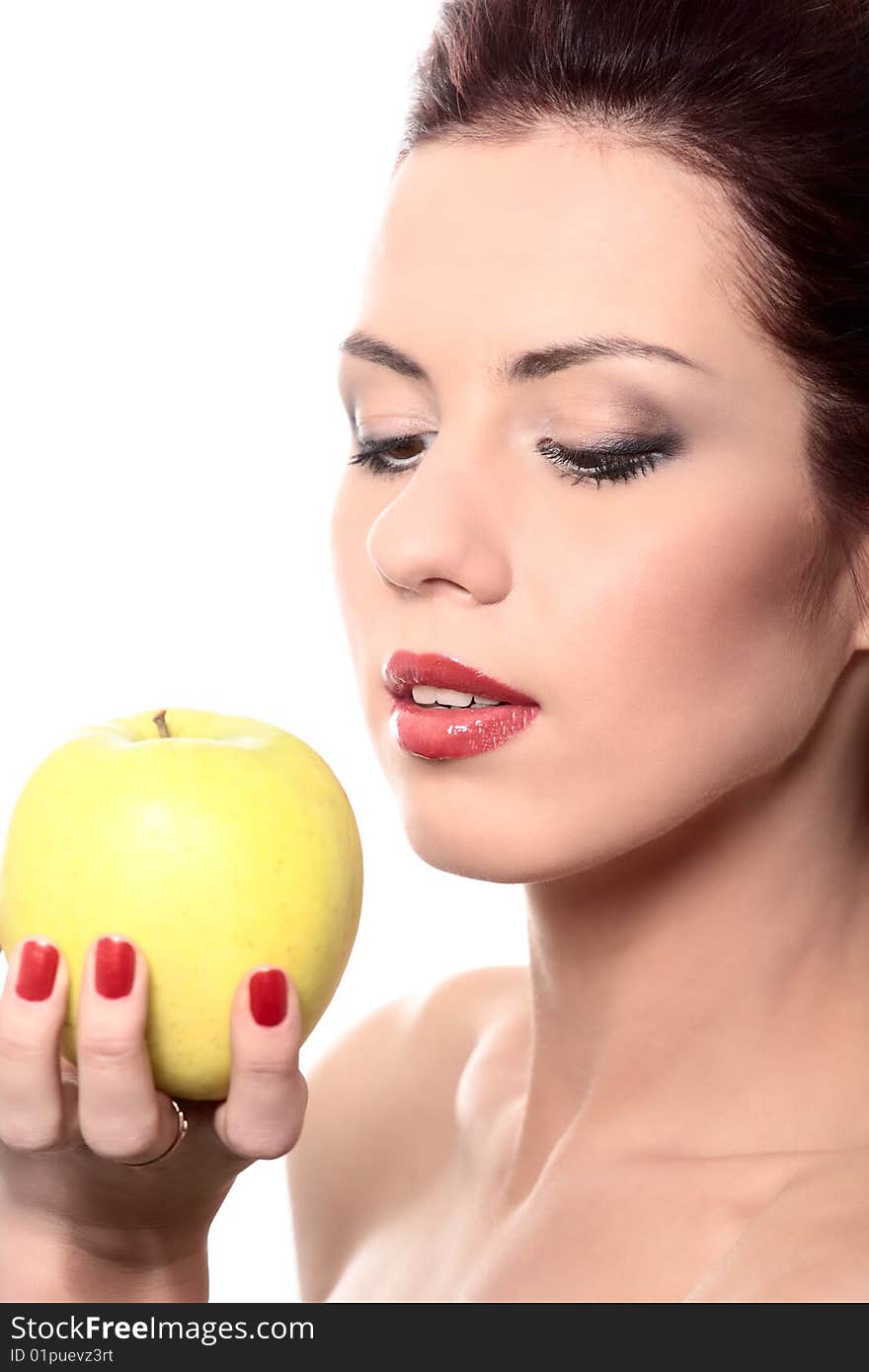 Close-up portrait of young beautiful healthy woman with yellow apple isolated on white. Close-up portrait of young beautiful healthy woman with yellow apple isolated on white