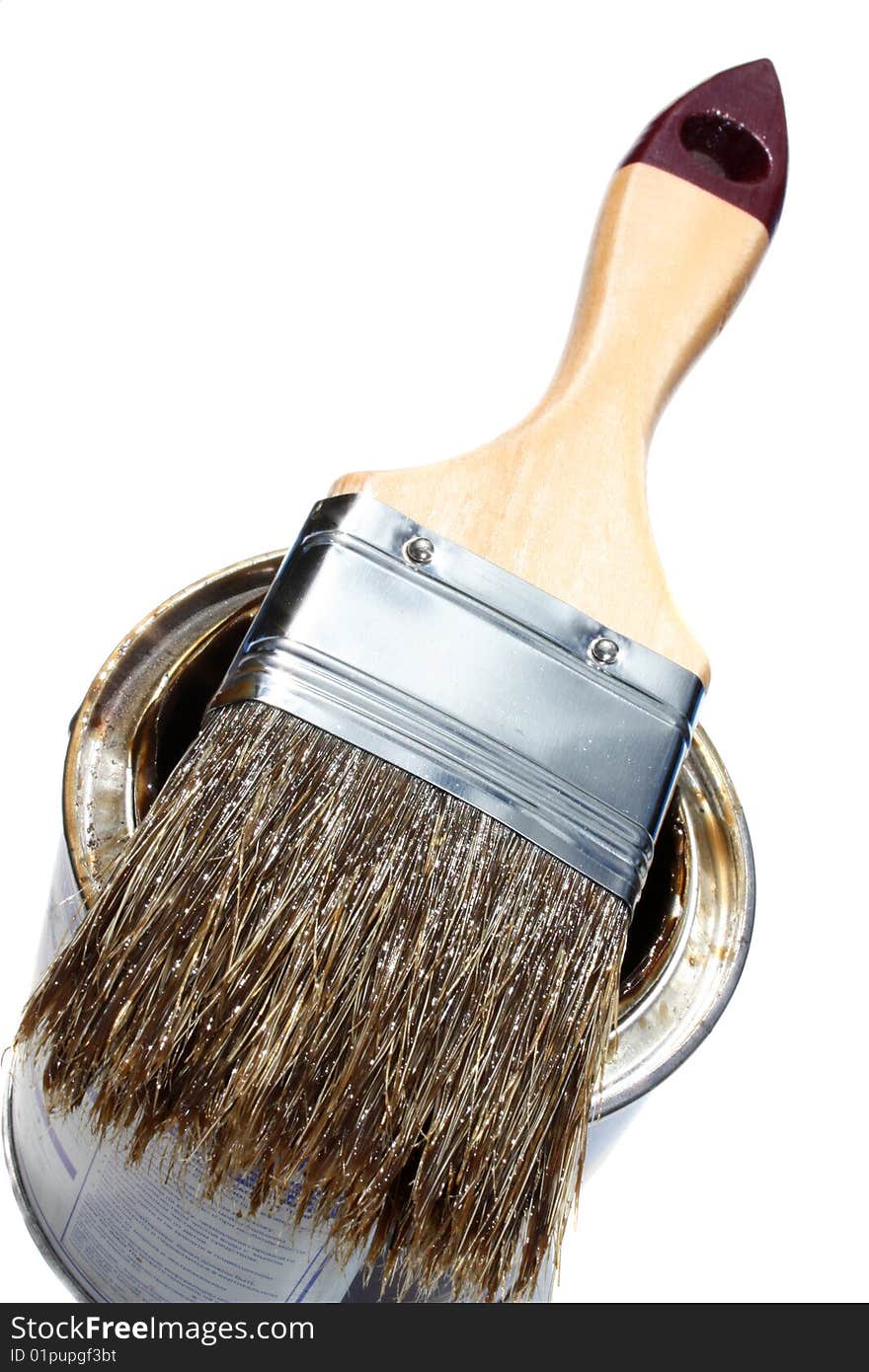 Brush on bank with a paint on a dark blue background.